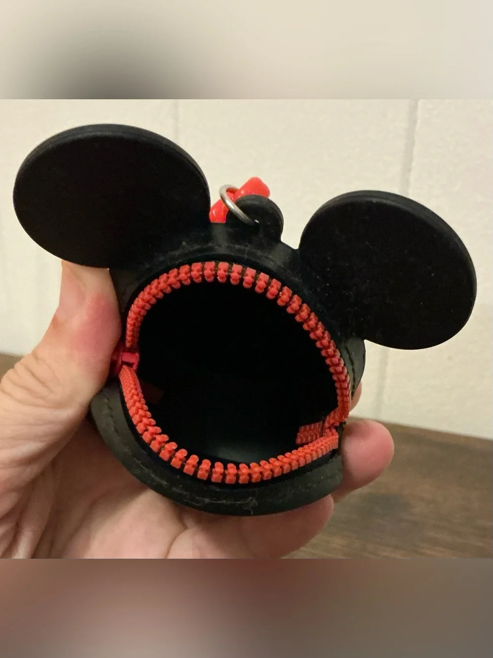 A rare Disney Parks Mickey Mouse silicon coin purse keychain